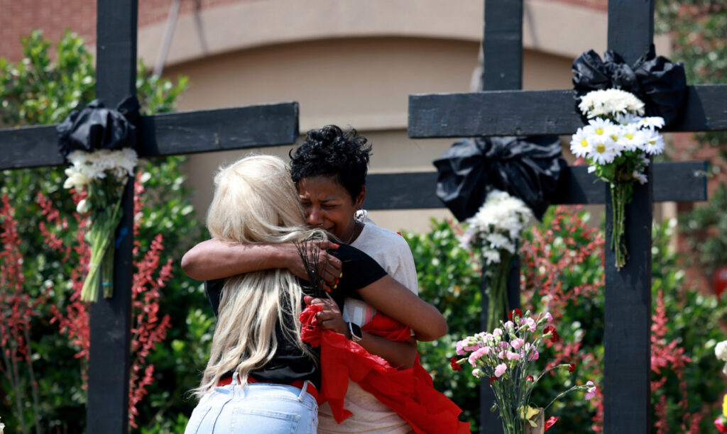Grieving hug after mass shooting