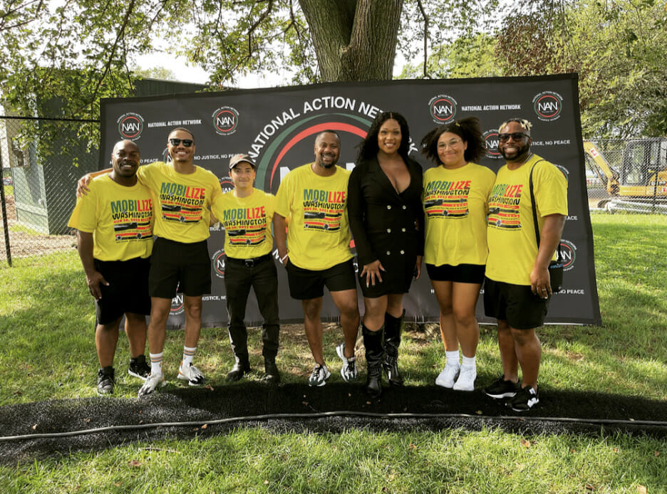 60th-march-on-wa-Picture2 | GLAAD From left to right - GLAAD’s Darian Aaron, Julian Walker, Lana Leonard, Jerrell Hardnett, Peppermint, Kayla Thompson, and DaShawn Usher stand together in front of the National Action Network banner
