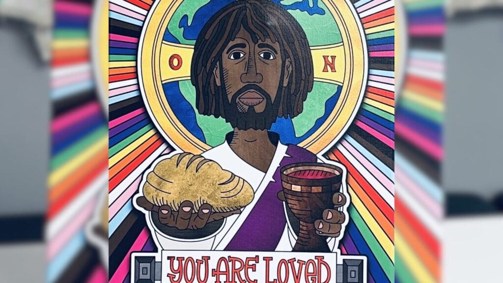 Rainbow and trans flag colors burst from a picture of the globe (green and blue) within the frame for the son the holy ghost, the spirit hovering around the head of Jesus, brown skin, with long black hair and a beard wearing a white robe holding out bread and wine. Underneath the photo it says: "YOU ARE LOVED" colored red.