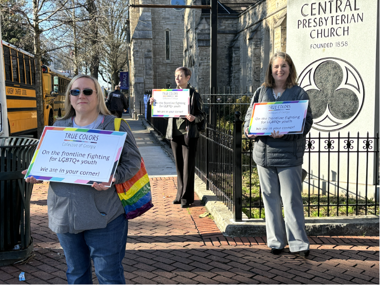 Members of the True Colors Collective of Georgia peacefully protest across the street from the Georgia State Capitol during the annual Legislative Prayer Breakfast on February 6, 2024. | GLAAD Members of the True Colors Collective of Georgia peacefully protest across the street from the Georgia State Capitol during the annual Legislative Prayer Breakfast on February 6, 2024.