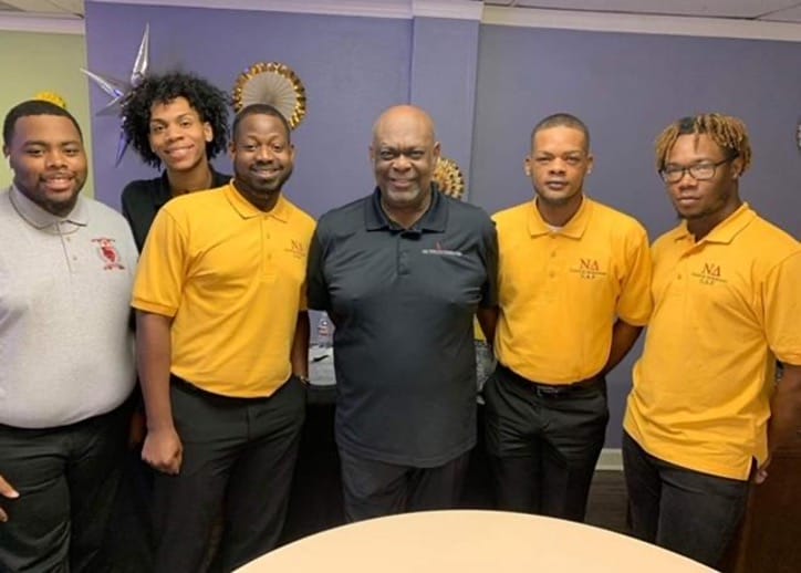 Arkansas Rapps Founder and CEO, Cornelius Mabin Jr., (center) poses with young community leaders in Little Rock, Arkansas in October 2022.