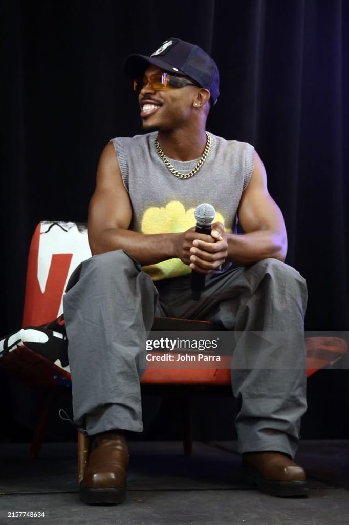 Donnie Hue Frazier III speaks on stage during the Queer Lens Brunch | GLAAD Donnie Hue Frazier III speaks on stage during the Queer Lens Brunch