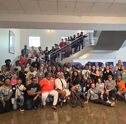 Malone (third row, left) is pictured with Georgia youth and adult advocates on day two of the Symposium at Georgia State University. (Image: Tim’m West) | GLAAD Malone (third row, left) is pictured with Georgia youth and adult advocates on day two of the Symposium at Georgia State University. (Image: Tim’m West)