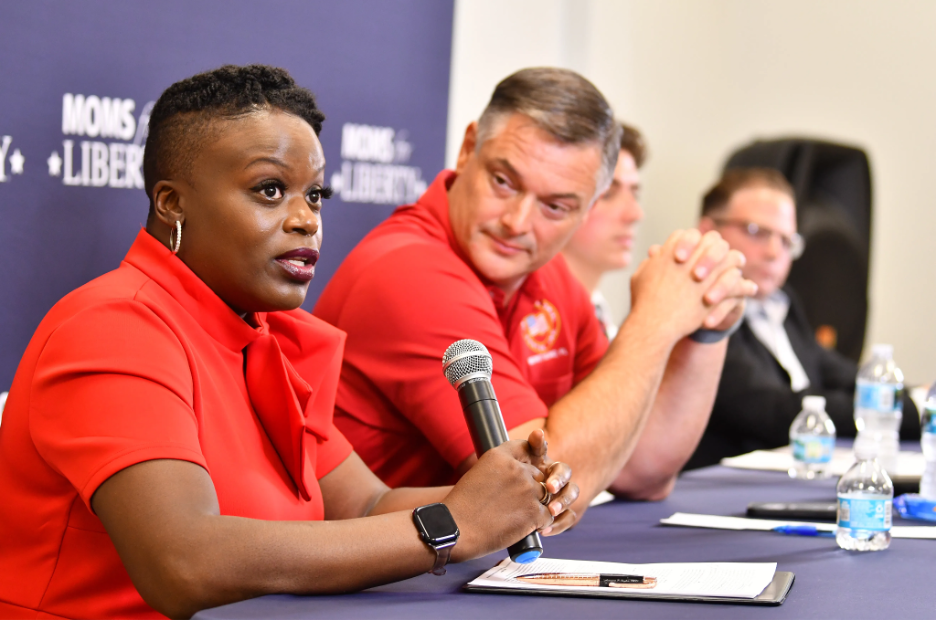 Avanese Taylor, left, answers a question at a Moms for Liberty-hosted candidate forum as opponent Matt Susin listens. | GLAAD Avanese Taylor, left, answers a question at a Moms for Liberty-hosted candidate forum as opponent Matt Susin listens.