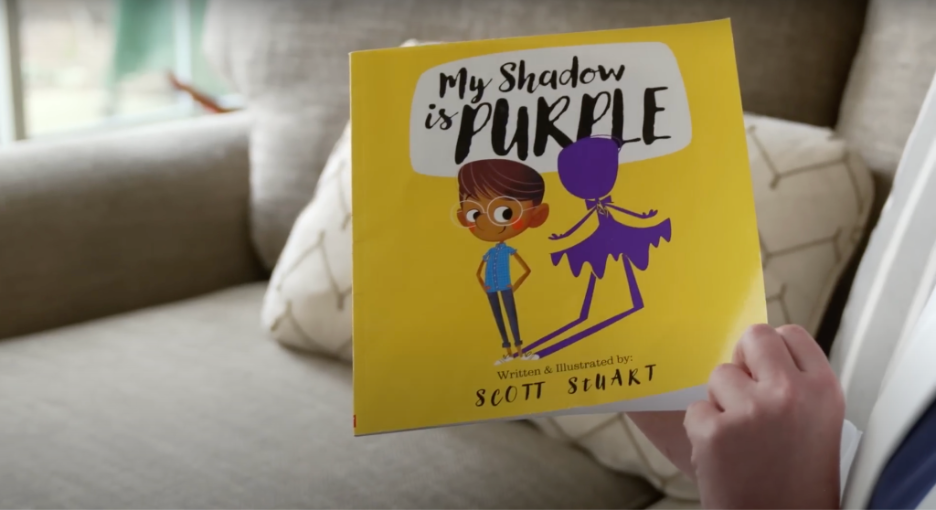 Katie Rinderle holds a copy of “My Shadow is Purple” in a video produced by The Southern Poverty Law Center. | GLAAD Katie Rinderle holds a copy of “My Shadow is Purple” in a video produced by The Southern Poverty Law Center.