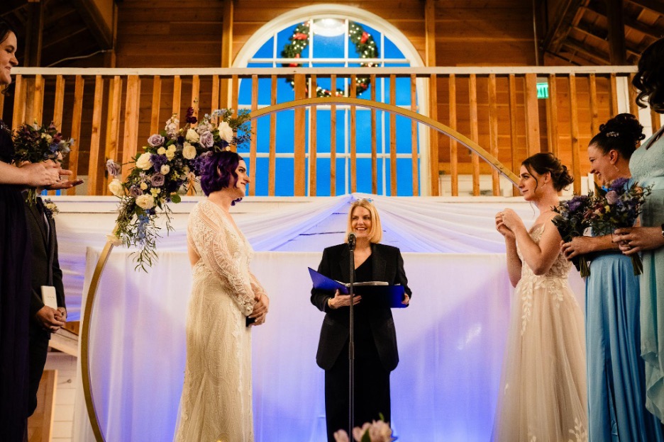 Erin Reed and Zooey Zephyr at their December 14th wedding in Missoula, MT. GLAAD President and CEO Sarah Kate Ellis officiated