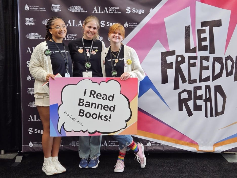 Left-to-right: Student activists Isabella Troy Brazoban, Elizabeth Foster, and Millie Bennett pose for a photo at the 2023 American Library Association Annual Conference. | GLAAD Left-to-right: Student activists Isabella Troy Brazoban, Elizabeth Foster, and Millie Bennett pose for a photo at the 2023 American Library Association Annual Conference.