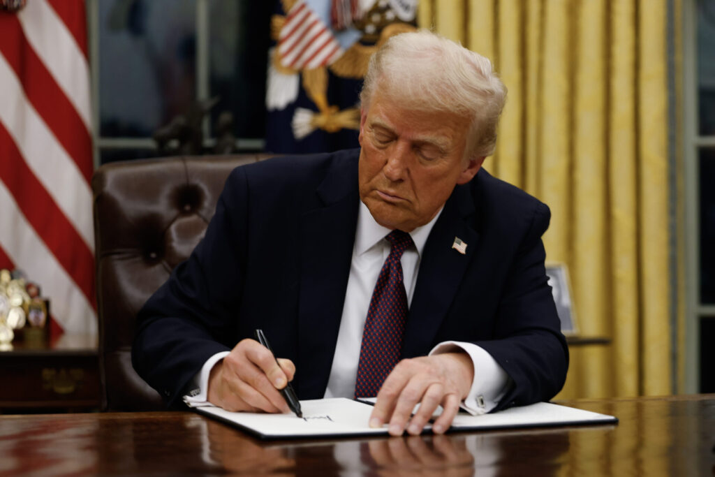 President Donald Trump signs executive orders in the Oval Office of the White House on January 20, 2025 in Washington, DC. Trump takes office for his second term as the 47th president of the United States. | GLAAD President Donald Trump signs executive orders in the Oval Office of the White House on January 20, 2025 in Washington, DC. Trump takes office for his second term as the 47th president of the United States.