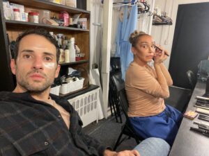 IMG_5480 | GLAAD Nic Cory, white, dark eyes and hair in a black shirt, and Cecilia Gentili, light brown skin,blond and brown hair, and dark eyes, wearing beige shirt and blue pants, get ready for the show.