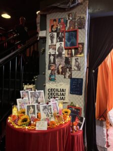 IMG_4734 | GLAAD A grief alter at Rattlestick Theater in the name of Cecilia Gentili showcasing images of her protesting, with loved ones, with a keffiyeh draped over the top of the alter