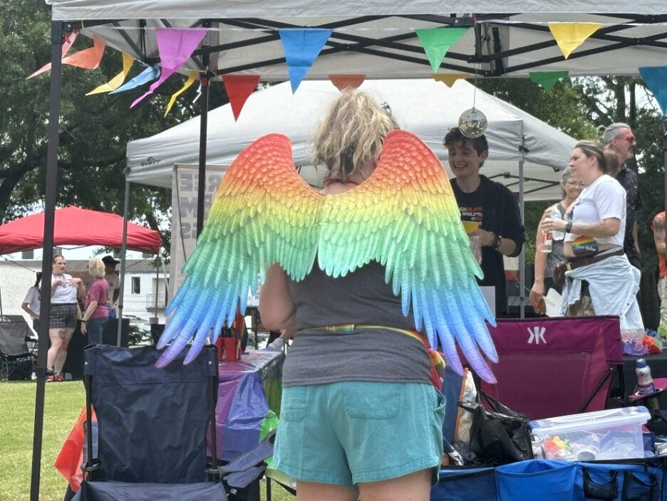 An attendee pictured in rainbow colored angel wings at Renaissance City Pride in Florence, AL. | GLAAD An attendee pictured in rainbow colored angel wings at Renaissance City Pride in Florence, AL.
