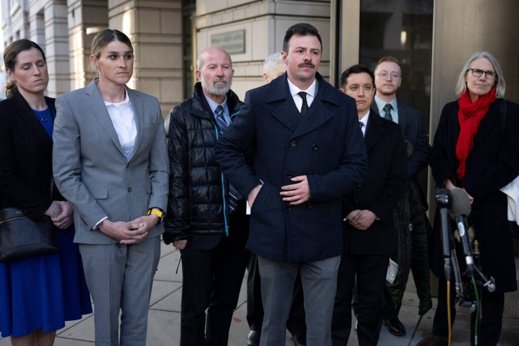 Plaintiffs Lt. Nicholas Talbott with other transgender military service personnel and attorneys from National Center for Lesbian Rights and GLAD Law seeking preliminary injunction against executive order barring open service, Washington, DC, Feb. 18, 2025.