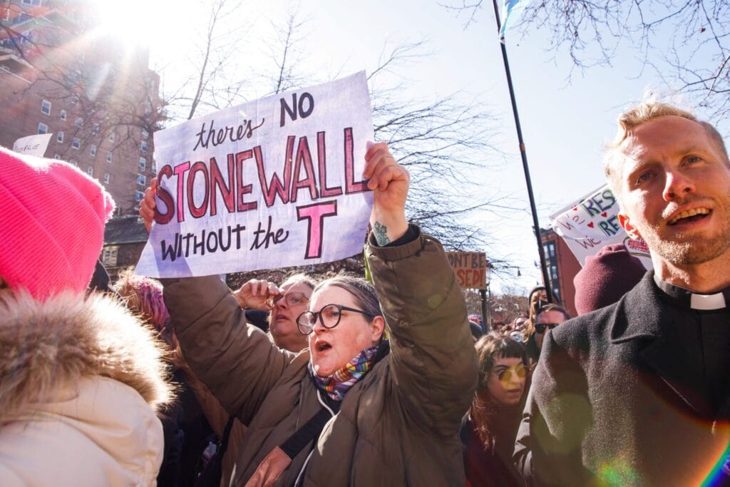 People protest outside the Stonewall Inn in New York, the scene of riots against police raids on the gay bar in 1969, on February 14, 2025, after the word transgender was erased from the National Park Service's webpage about the riots. | GLAAD People protest outside the Stonewall Inn in New York, the scene of riots against police raids on the gay bar in 1969, on February 14, 2025, after the word transgender was erased from the National Park Service's webpage about the riots.