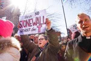 People protest outside the Stonewall Inn in New York, the scene of riots against police raids on the gay bar in 1969, on February 14, 2025, after the word transgender was erased from the National Park Service's webpage about the riots. | GLAAD People protest outside the Stonewall Inn in New York, the scene of riots against police raids on the gay bar in 1969, on February 14, 2025, after the word transgender was erased from the National Park Service's webpage about the riots.