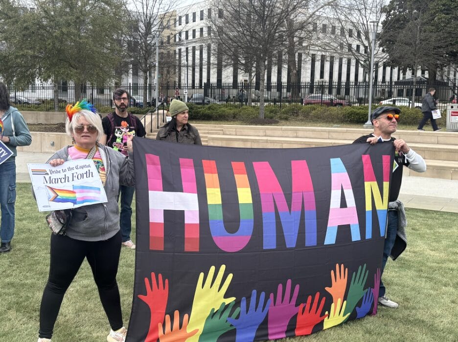 “Human” protest sign held by advocates during the Pride at the Capitol rally on March 4, 2025. | GLAAD “Human” protest sign held by advocates during the Pride at the Capitol rally on March 4, 2025.