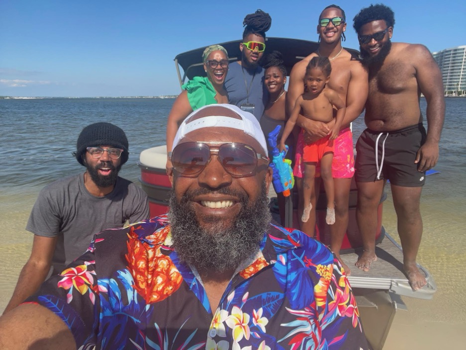 Preston Howard Sr., along with his family, pose for a selfie on vacation.