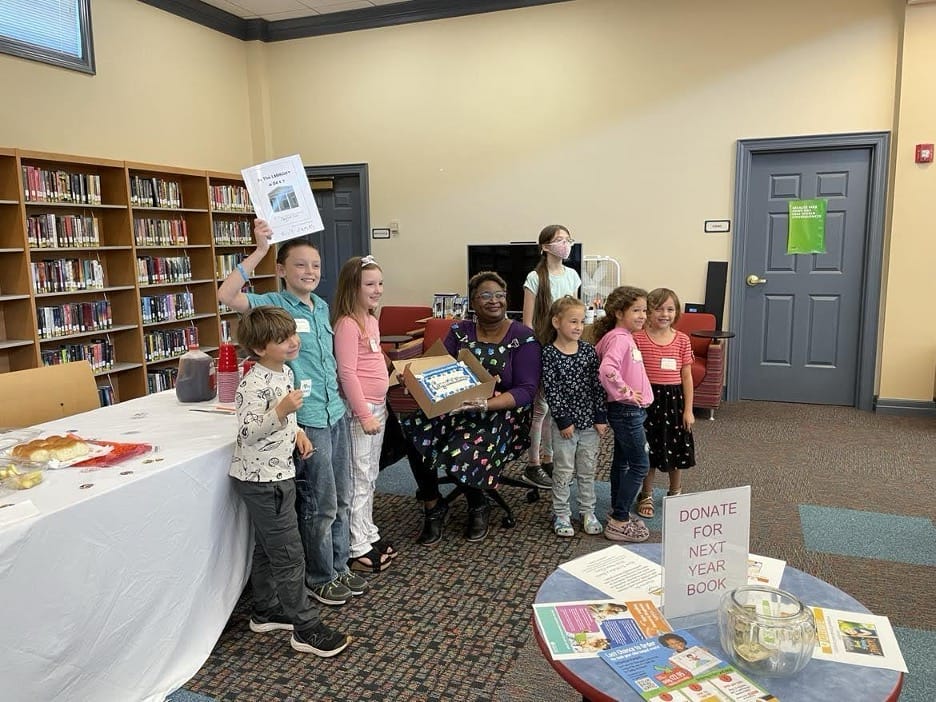 LaVonnia Moore (center) pictured with young library patrons in her previous role as Pierce County Library manager. | GLAAD LaVonnia Moore pictured with young library patrons in her previous role as Pierce County Library manager.