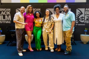 ABFF17 | GLAAD Six people posing together at the American Black Film Festival stage, smiling.",
