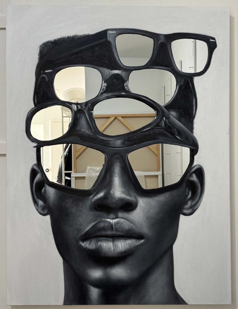 Grayscale portrait of a person with oversized, interlocking cutout glasses creating hollow shapes over the face.